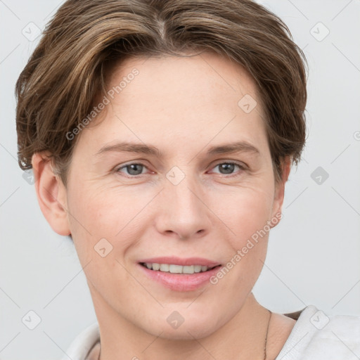 Joyful white young-adult female with short  brown hair and grey eyes