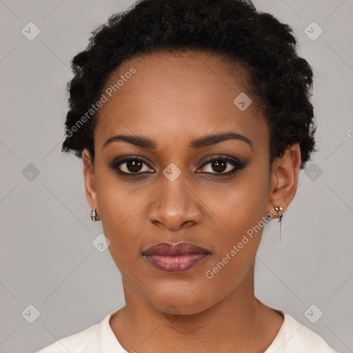 Joyful black young-adult female with short  black hair and brown eyes