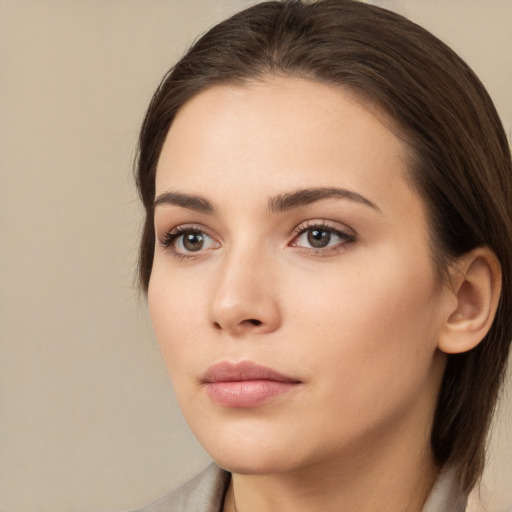 Neutral white young-adult female with medium  brown hair and brown eyes