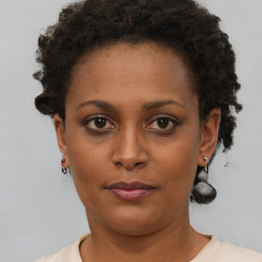 Neutral black young-adult female with short  brown hair and brown eyes