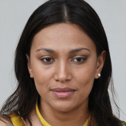 Joyful white young-adult female with long  brown hair and brown eyes