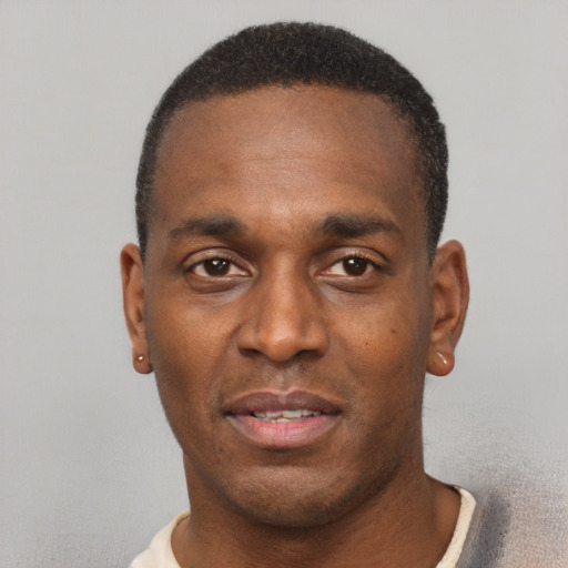 Neutral black adult male with short  black hair and brown eyes
