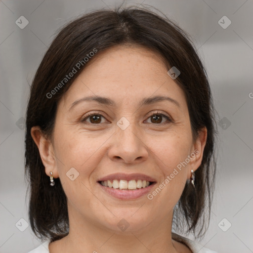 Joyful white adult female with medium  brown hair and brown eyes