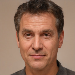 Joyful white middle-aged male with short  brown hair and brown eyes