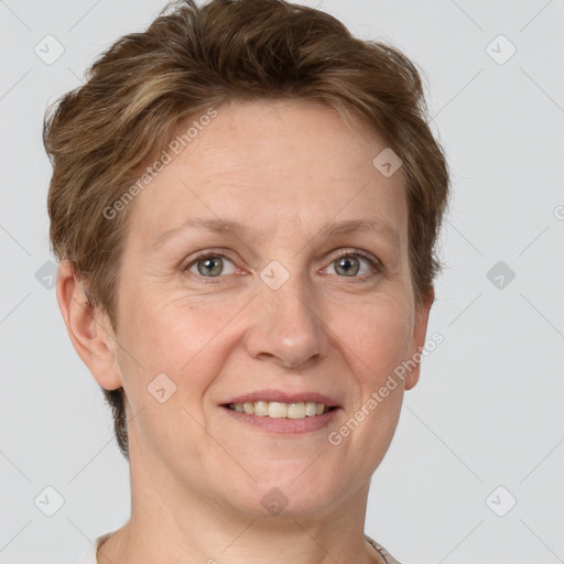 Joyful white adult female with short  brown hair and grey eyes