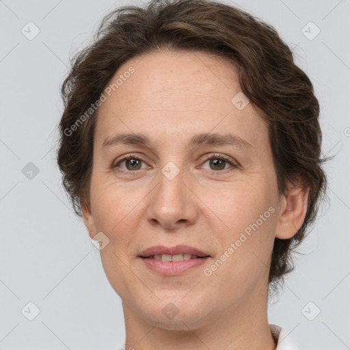 Joyful white adult female with short  brown hair and grey eyes