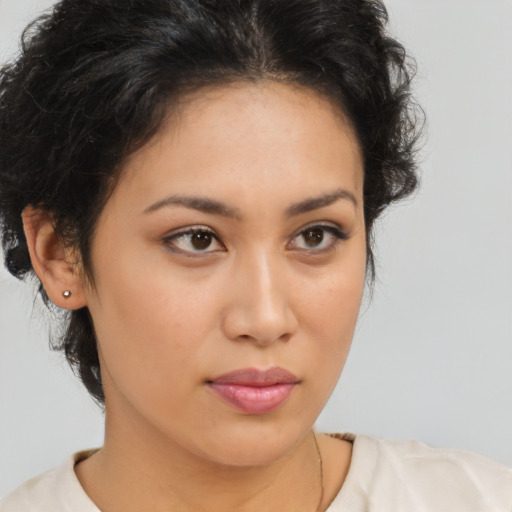 Neutral latino young-adult female with medium  brown hair and brown eyes