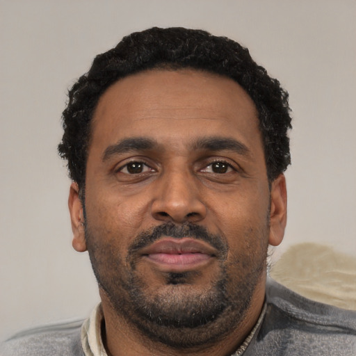 Neutral latino adult male with short  black hair and brown eyes