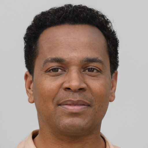 Neutral latino adult male with short  brown hair and brown eyes