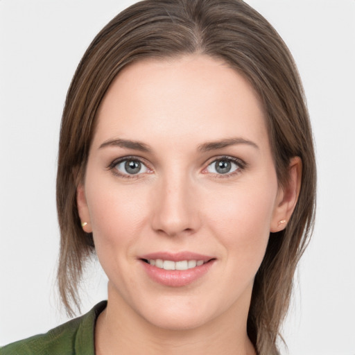 Joyful white young-adult female with medium  brown hair and grey eyes