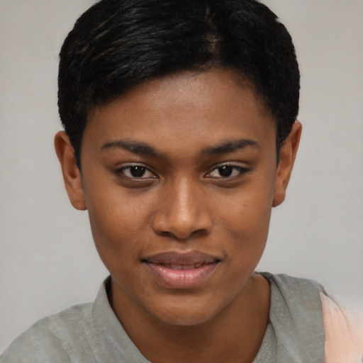 Joyful black young-adult female with short  black hair and brown eyes
