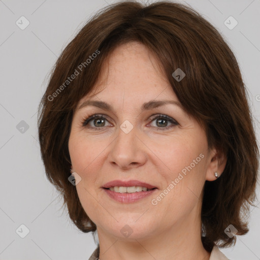 Joyful white adult female with medium  brown hair and brown eyes