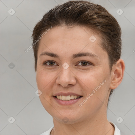 Joyful white young-adult female with short  brown hair and brown eyes