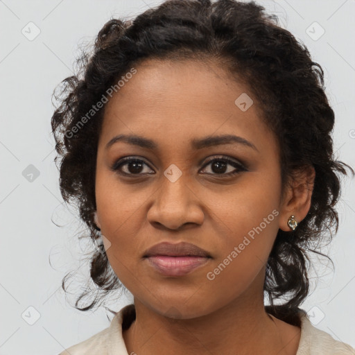 Joyful black young-adult female with medium  brown hair and brown eyes