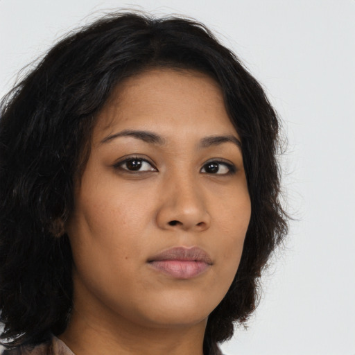 Neutral latino young-adult female with long  brown hair and brown eyes