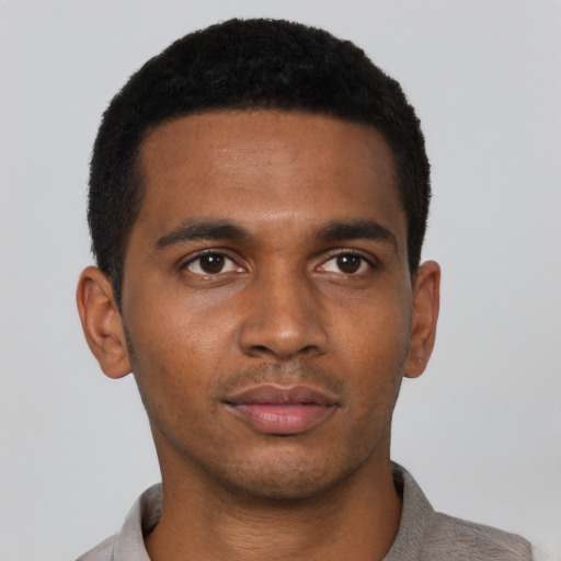 Neutral black young-adult male with short  black hair and brown eyes