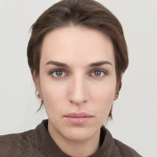 Neutral white young-adult female with short  brown hair and brown eyes