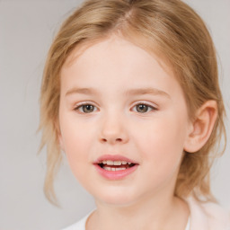 Joyful white child female with medium  brown hair and brown eyes