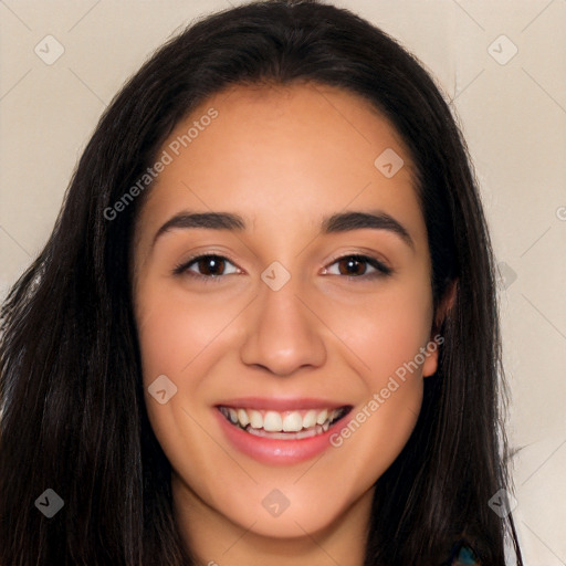 Joyful latino young-adult female with long  black hair and brown eyes