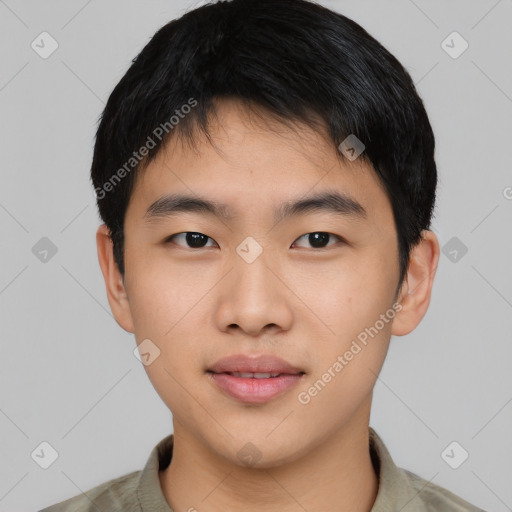 Joyful asian young-adult male with short  black hair and brown eyes