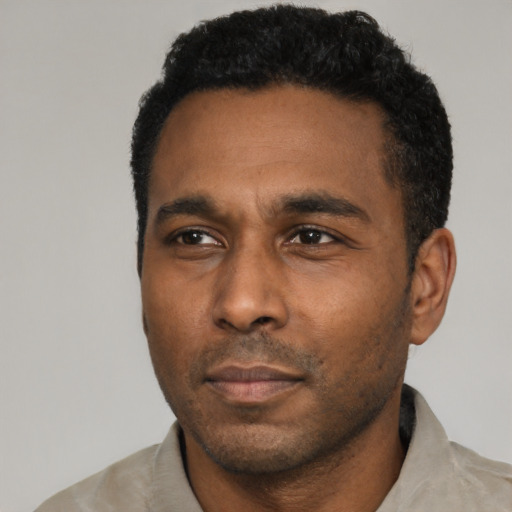 Neutral latino adult male with short  black hair and brown eyes