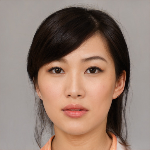 Neutral asian young-adult female with medium  brown hair and brown eyes