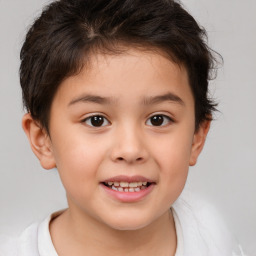 Joyful white child male with short  brown hair and brown eyes