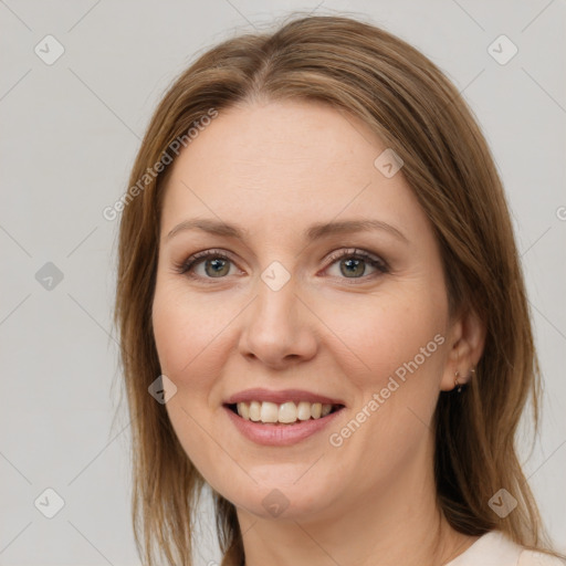 Joyful white young-adult female with medium  brown hair and green eyes