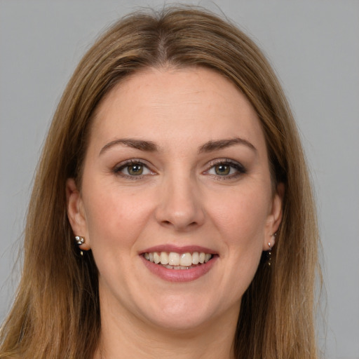 Joyful white young-adult female with long  brown hair and grey eyes