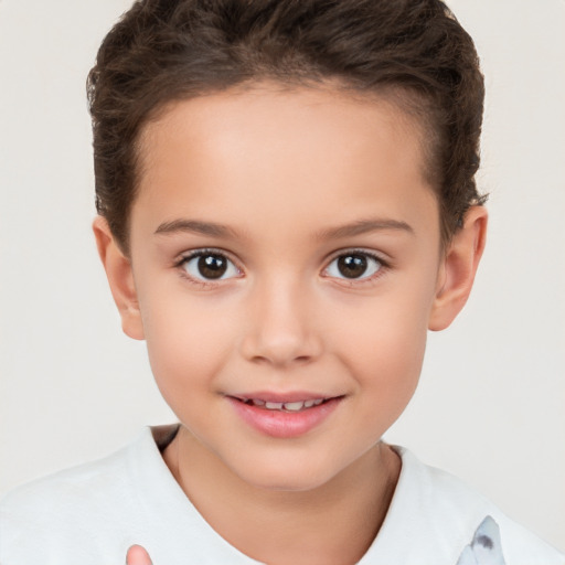 Joyful white child female with short  brown hair and brown eyes