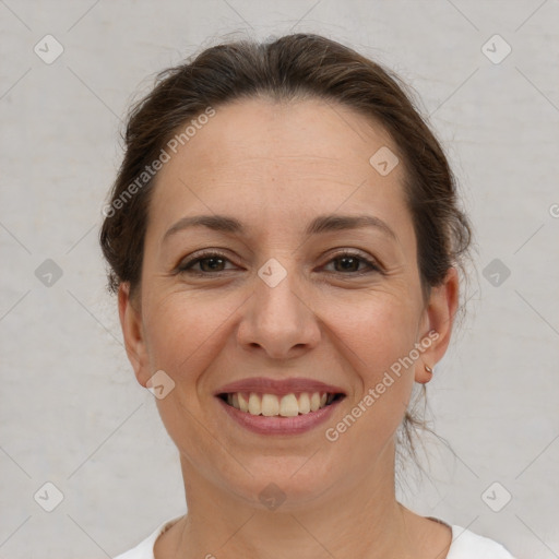 Joyful white adult female with short  brown hair and brown eyes