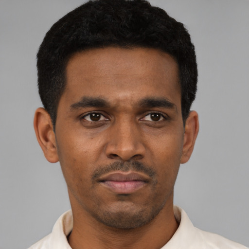 Neutral latino young-adult male with short  black hair and brown eyes