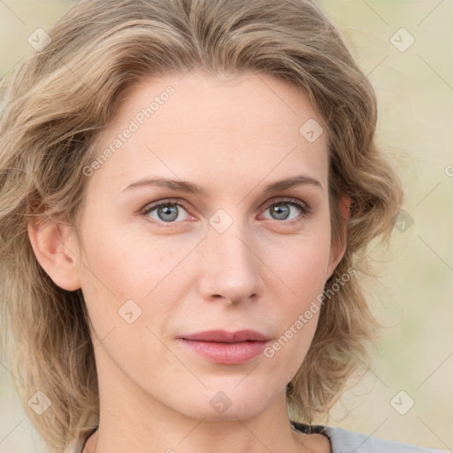 Joyful white young-adult female with medium  brown hair and blue eyes