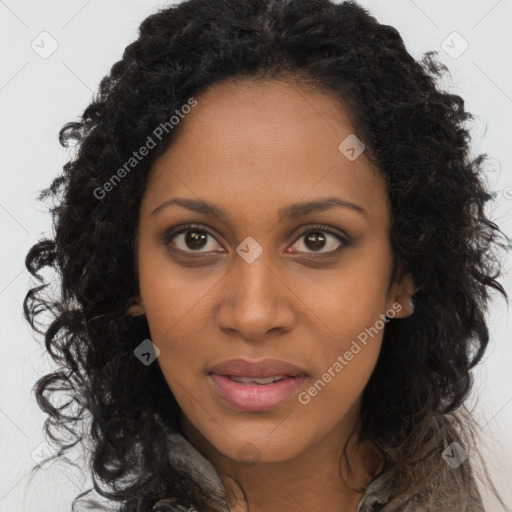 Joyful black young-adult female with long  brown hair and brown eyes