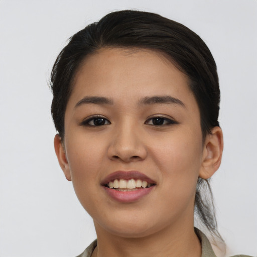 Joyful asian young-adult female with medium  brown hair and brown eyes