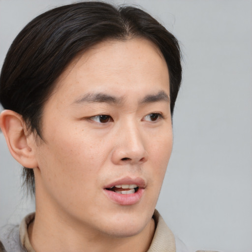 Neutral asian young-adult male with medium  brown hair and brown eyes