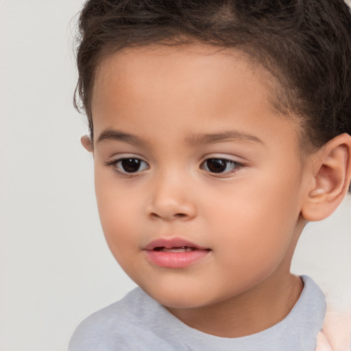 Joyful white child female with short  brown hair and brown eyes