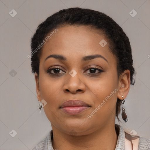 Joyful black young-adult female with short  black hair and brown eyes