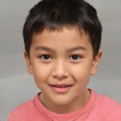 Joyful white child male with short  brown hair and brown eyes