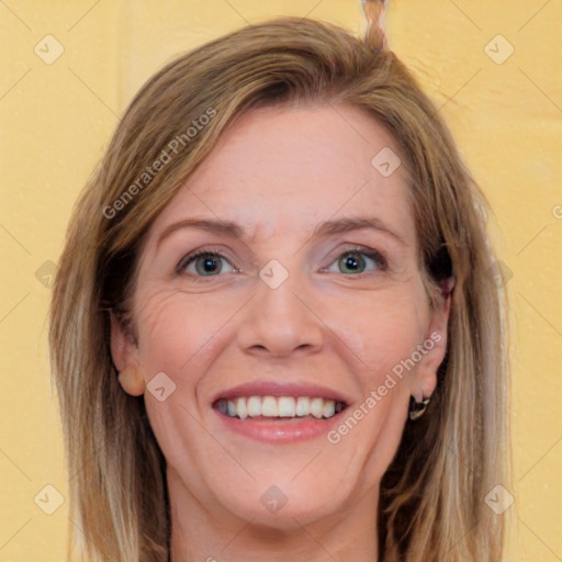 Joyful white young-adult female with long  brown hair and green eyes