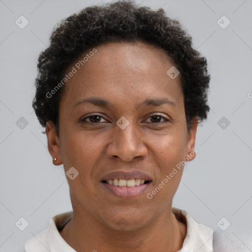 Joyful black adult female with short  brown hair and brown eyes