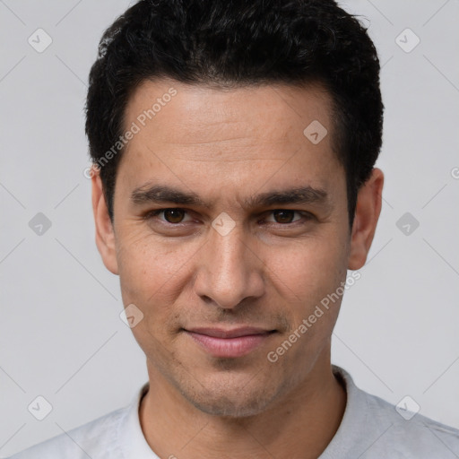 Joyful white young-adult male with short  black hair and brown eyes