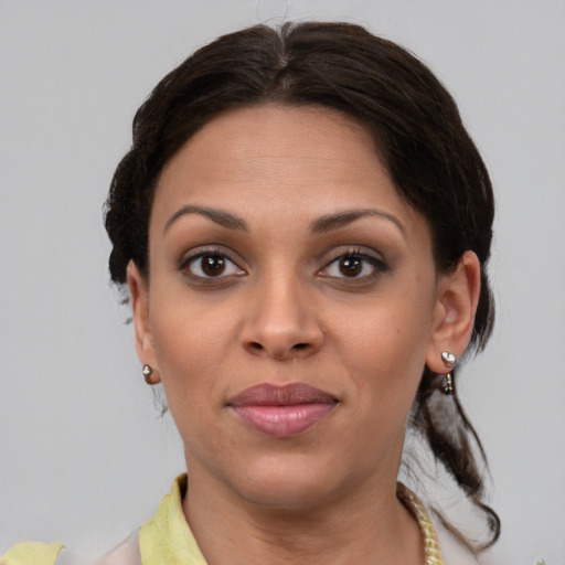 Joyful black young-adult female with medium  brown hair and brown eyes