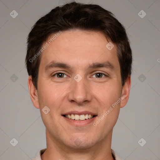 Joyful white adult male with short  brown hair and grey eyes