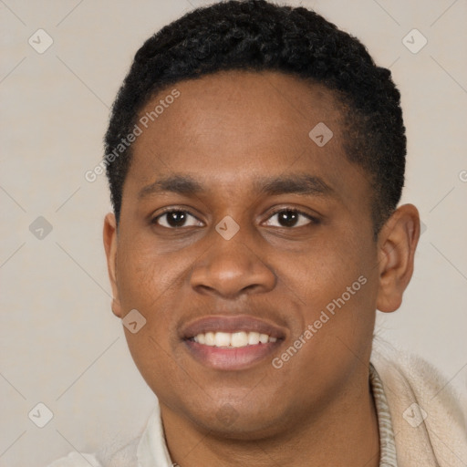 Joyful black young-adult male with short  black hair and brown eyes