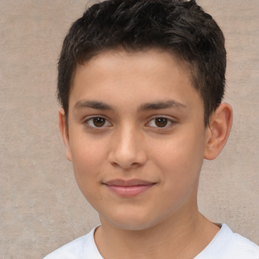 Joyful white child male with short  brown hair and brown eyes