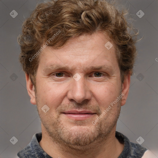 Joyful white adult male with short  brown hair and grey eyes