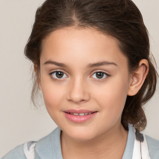 Joyful white child female with medium  brown hair and brown eyes