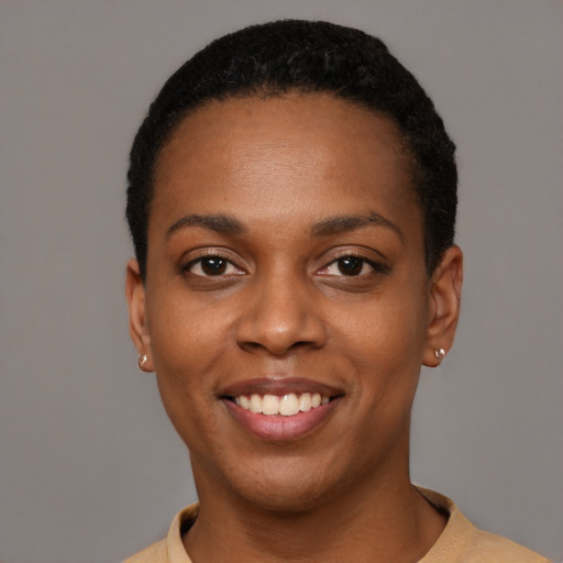 Joyful black young-adult female with short  black hair and brown eyes