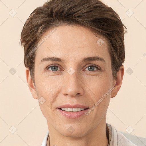 Joyful white adult female with short  brown hair and grey eyes